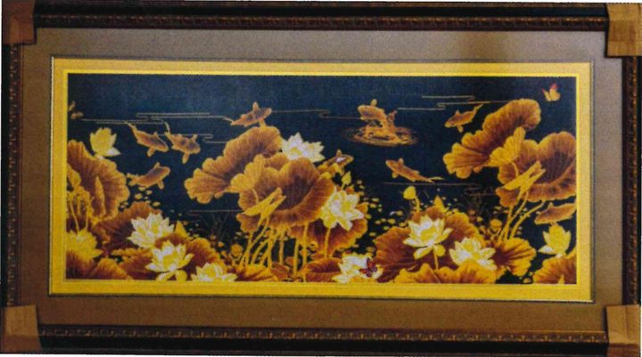 Long cross-stitch artwork of golden lotus leaves, white lotus flowers and gold koi fish on a deep navy ground.